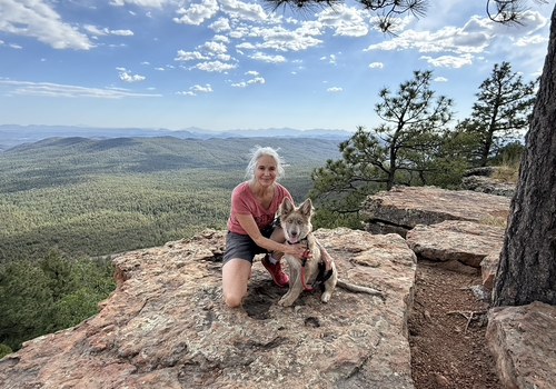 Ché hiking with her dog on a Sedona overlook